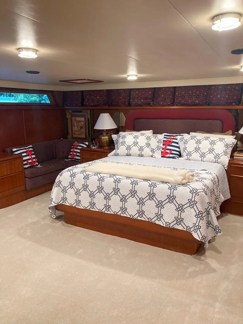 Slide: The Image of Luxurious bedroom in a 1988 Viking 70 Cockpit Motor Yacht with elegant decor. - 50