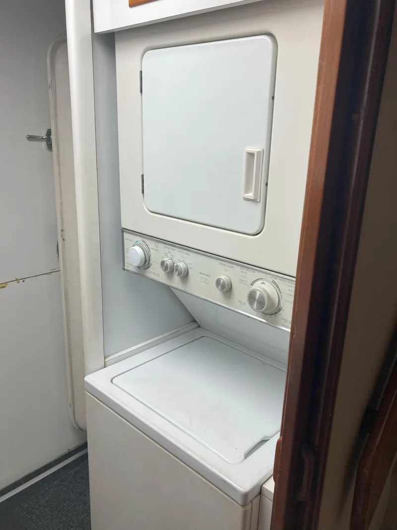 Slide: The Image of Stacked washer and dryer in 1988 Viking 70 Cockpit Motor Yacht. - 52