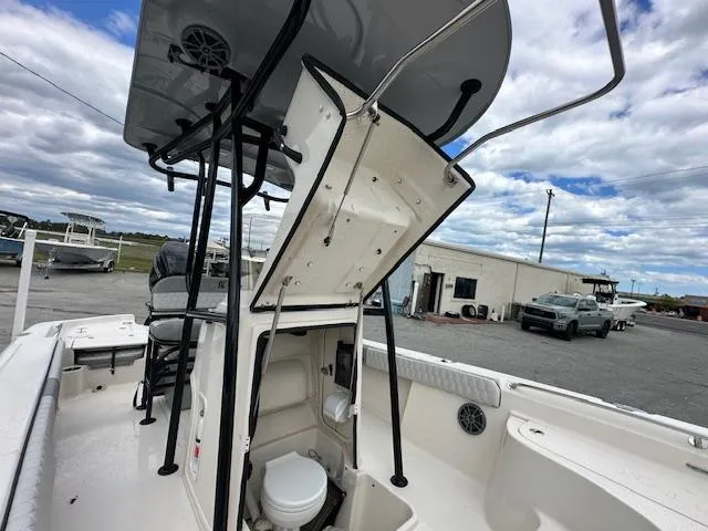 Slide: The Image of 2024 Carolina Skiff 23 LX boat with open console and marine toilet. - 17