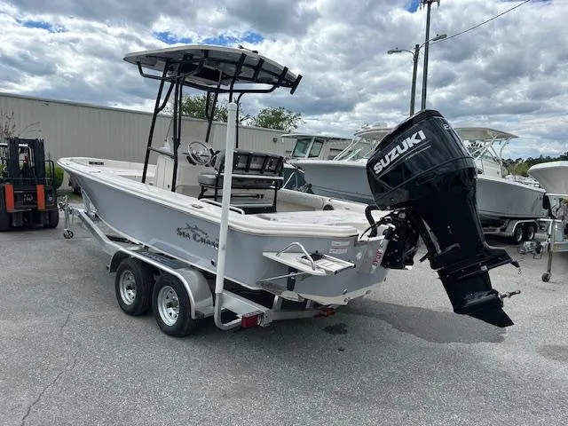 Slide: The Image of 2024 Carolina Skiff 23 LX boat with Suzuki outboard motor on trailer. - 3