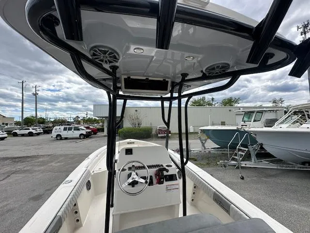 Slide: The Image of 2024 Carolina Skiff 23 LX center console boat with T-top and steering wheel. - 4