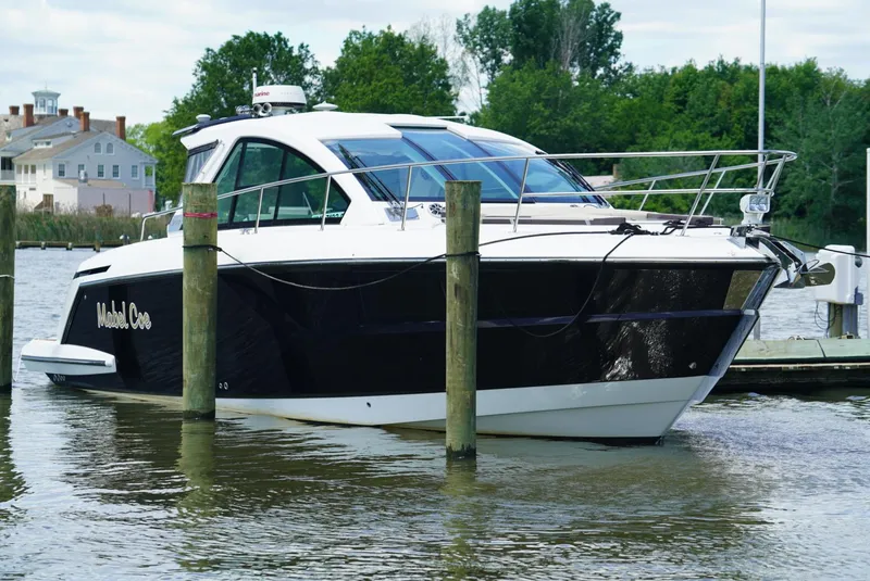 Slide: The Image of 2018 Monterey 360 Sport Coupe docked in a marina. - 2