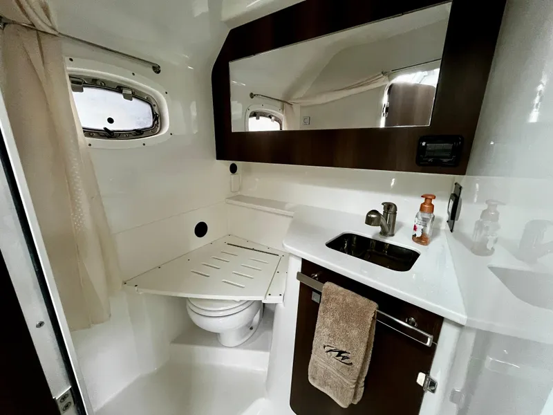 Slide: The Image of 2018 Monterey 360 Sport Coupe bathroom with sink, mirror, and toilet. - 20