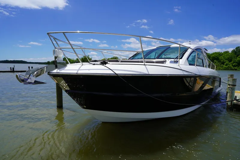 Slide: The Image of 2018 Monterey 360 Sport Coupe docked on a sunny day. - 3