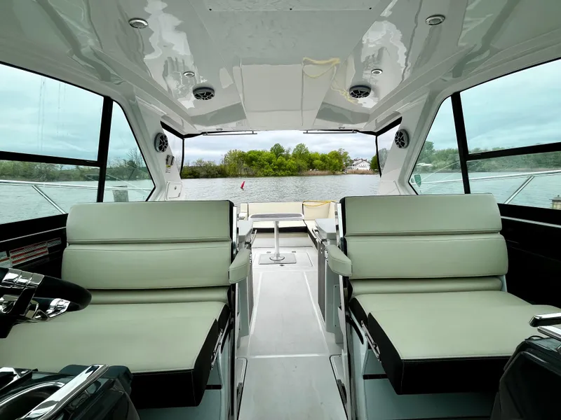 Slide: The Image of Interior of a 2018 Monterey 360 Sport Coupe yacht with luxurious seating. - 8