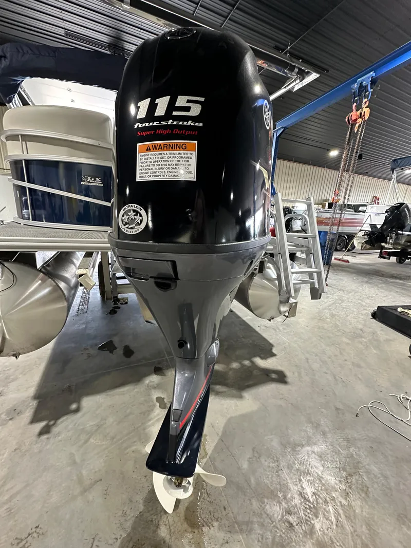 Slide: The Image of 2024 Starcraft LX22RDH pontoon boat with a 115 horsepower outboard motor. - 9