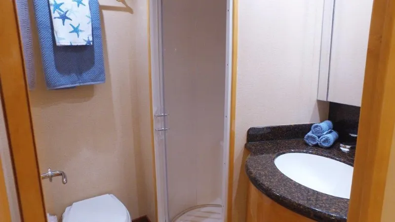 Slide: The Image of Bathroom interior of 2006 Hatteras Enclosed Bridge yacht with shower and sink. - 17