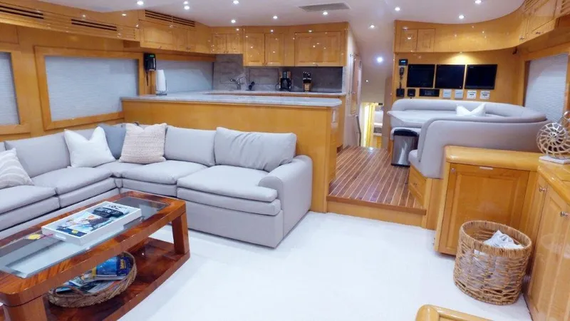 Slide: The Image of Luxurious interior of a 2006 Hatteras Enclosed Bridge yacht with modern furnishings. - 2