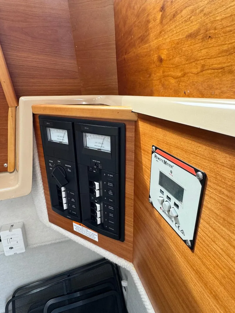 Slide: The Image of Control panel inside a 2017 Cutwater C28 boat, featuring gauges and switches. - 20