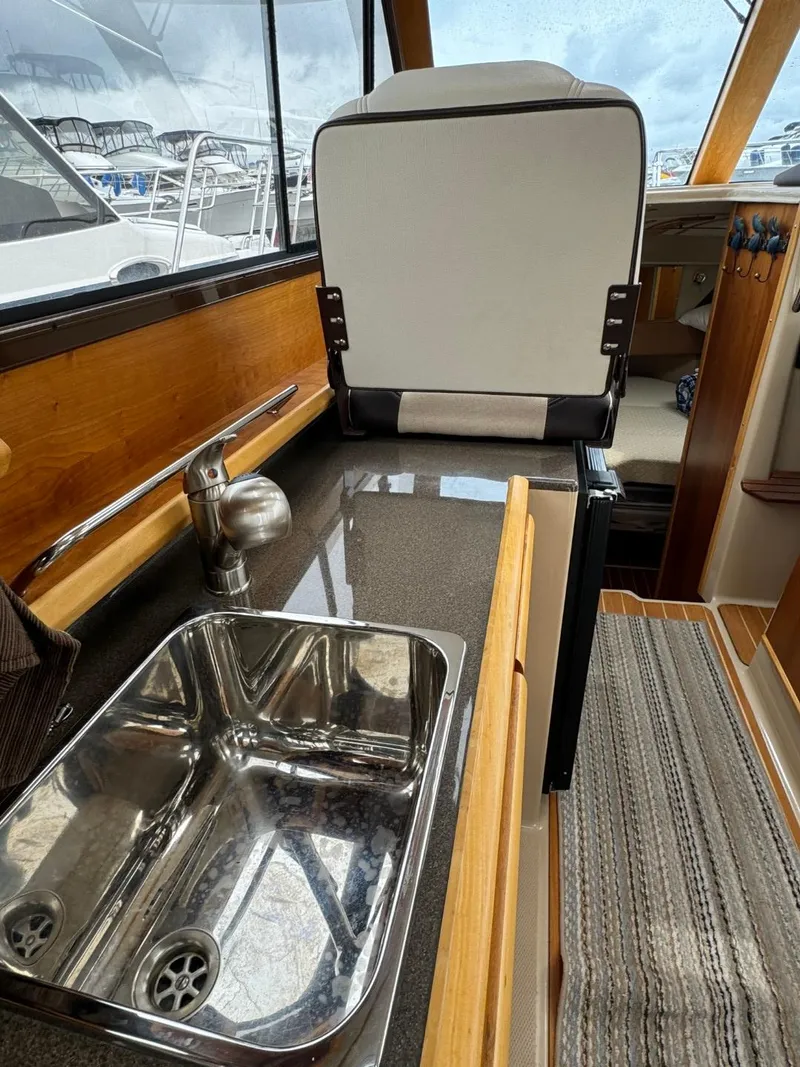 Slide: The Image of 2017 Cutwater C28 interior with sink and seating, showcasing modern design and functionality. - 37