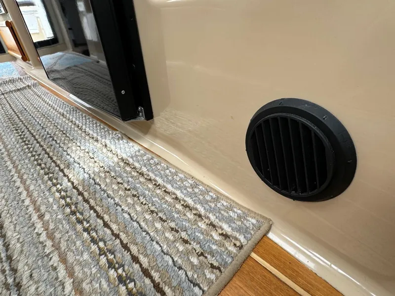 Slide: The Image of Interior of 2017 Cutwater C28 boat with vent and carpeted floor. - 40