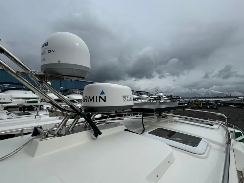 Slide: The Image of 2017 Cutwater C28 boat with Garmin radar, docked under cloudy skies. - 43