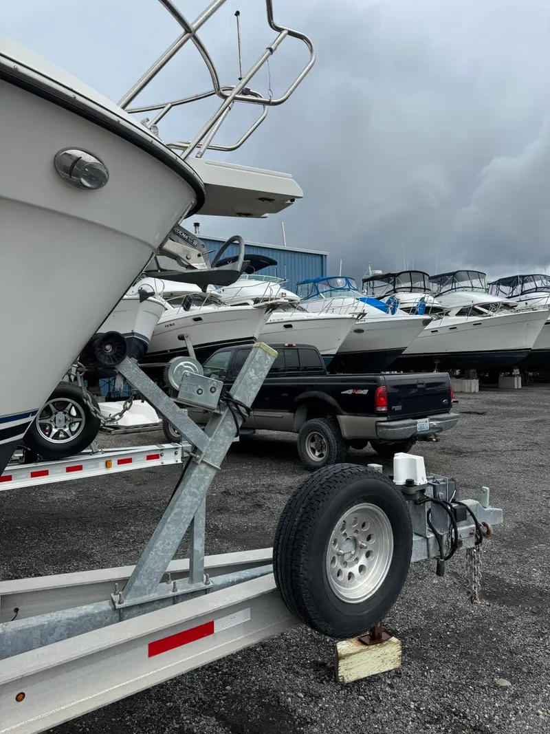 Slide: The Image of 2017 Cutwater C28 boat on trailer in marina with overcast sky. - 45