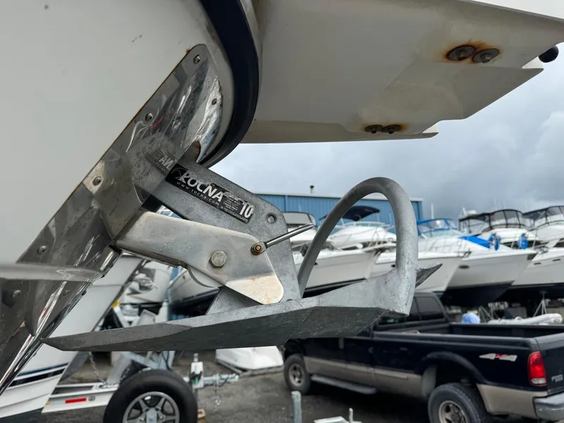 Slide: The Image of 2017 Cutwater C28 boat with Rocna anchor, docked near other boats and vehicles. - 46