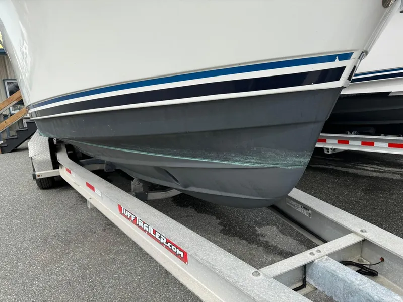 Slide: The Image of 2017 Cutwater C28 boat on trailer, showing hull and trailer details. - 47