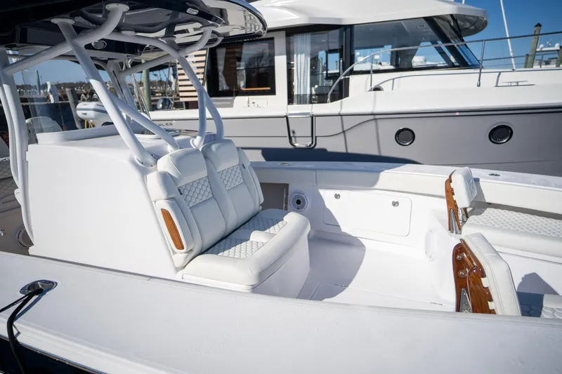 Slide: The Image of 2024 Jupiter 32 boat interior with white seating and modern design. - 13