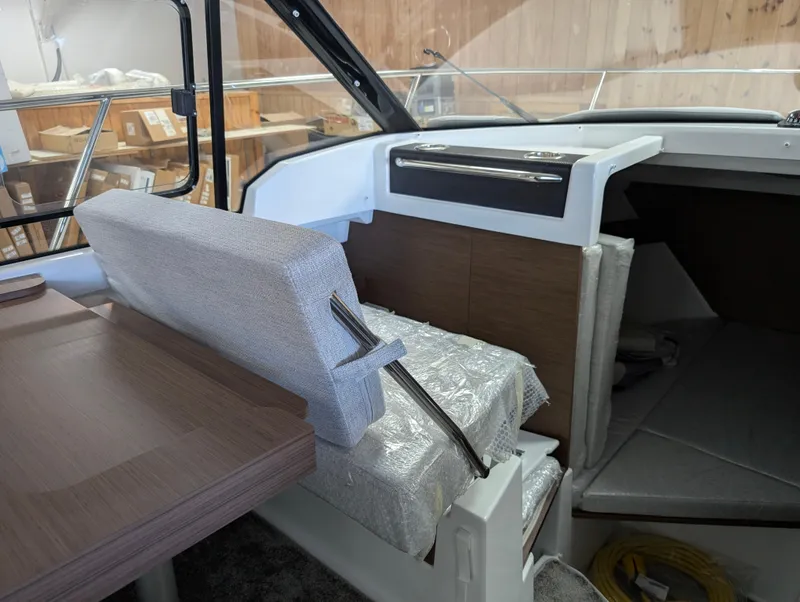 Slide: The Image of 2024 Jeanneau NC795 S2 interior with seating and cabin view. - 10