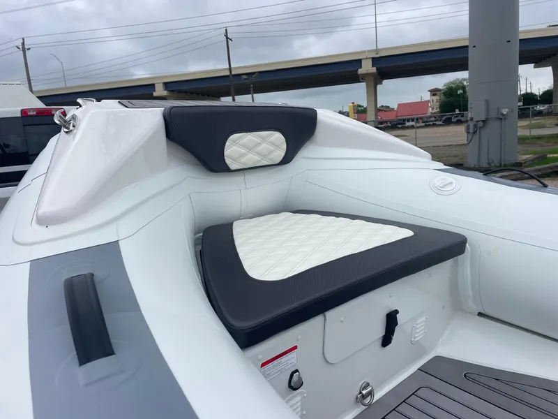 Slide: The Image of 2024 Highfield Sport 460 boat dashboard with steering wheel and controls. - 10