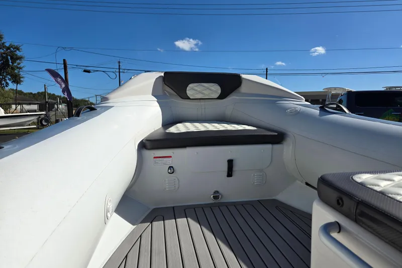 Slide: The Image of 2024 Highfield Sport 460 boat interior with cushioned seating and sleek design. - 15