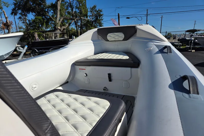 Slide: The Image of 2024 Highfield Sport 460 boat interior with quilted seating, showcasing modern design and comfort. - 16