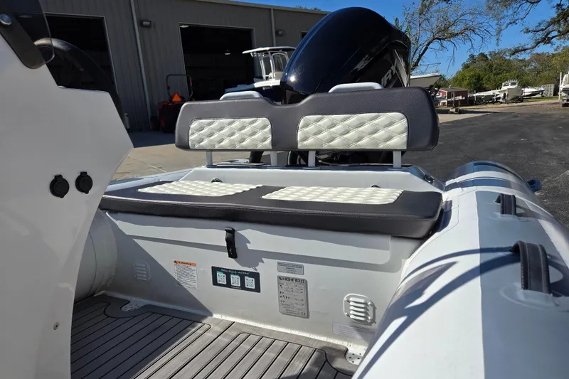 Slide: The Image of 2024 Highfield Sport 460 boat interior with cushioned seating and modern design. - 18