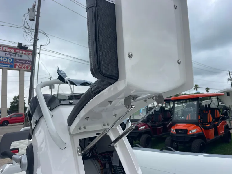 Slide: The Image of 2024 Highfield Sport 460 inflatable boat on trailer, parked outdoors. - 5