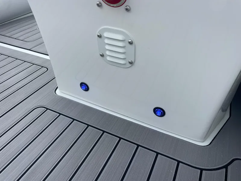 Slide: The Image of 2024 Highfield Sport 460 boat with Mercury engine, featuring sleek design and modern controls. - 8