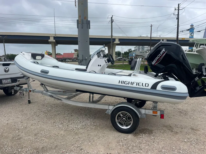 Slide: The Image of 2024 Highfield Sport 460 boat with Mercury 75 engine, showcasing sleek design and modern features. - 9