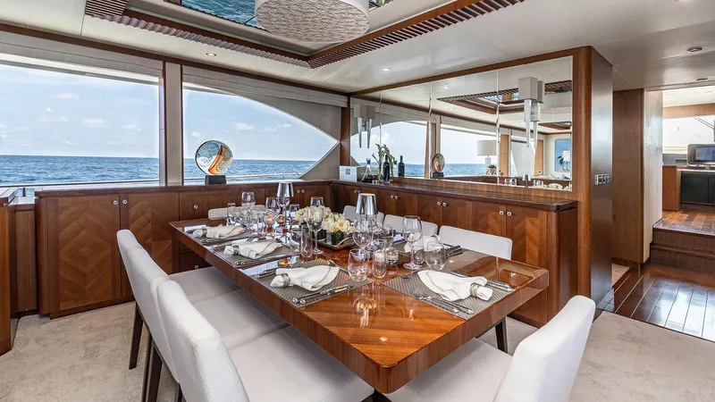 Slide: The Image of Luxurious dining area on 2015 Ocean Alexander Motoryacht Open Bridge, featuring elegant table settings and ocean views. - 15