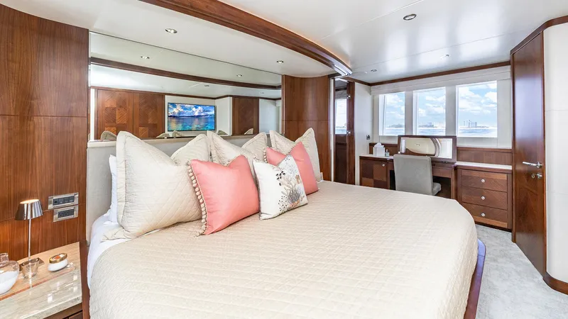 Slide: The Image of Luxurious bedroom in 2015 Ocean Alexander Motoryacht Open Bridge with elegant decor and large windows. - 28
