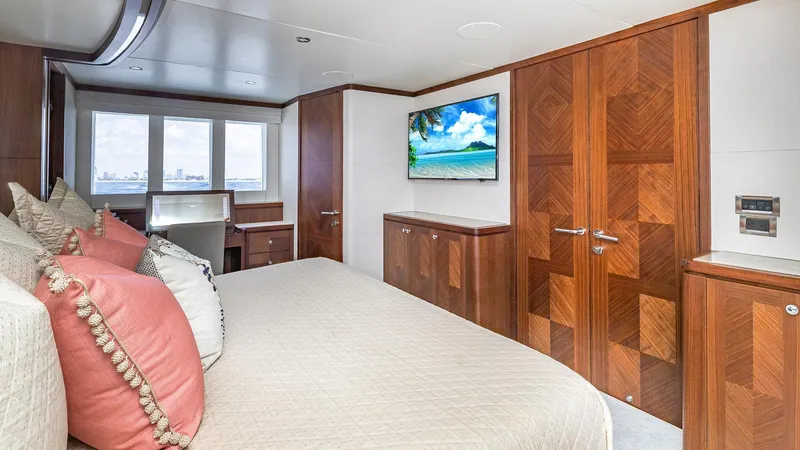 Slide: The Image of Luxurious bedroom in 2015 Ocean Alexander Motoryacht Open Bridge with wood accents and ocean view. - 29