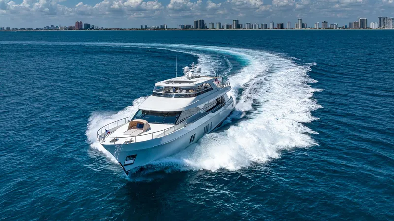 Slide: The Image of 2015 Ocean Alexander Motoryacht Open Bridge cruising on blue ocean near city skyline. - 3