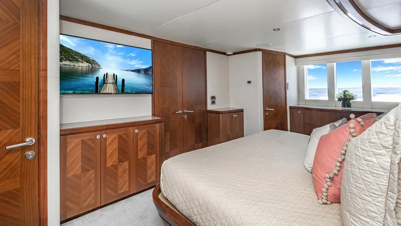 Slide: The Image of Luxurious bedroom interior of 2015 Ocean Alexander Motoryacht Open Bridge with wood finishes and ocean view. - 31