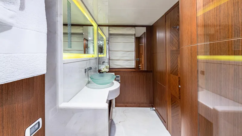 Slide: The Image of Luxurious bathroom in 2015 Ocean Alexander Motoryacht Open Bridge with modern fixtures and wood accents. - 33