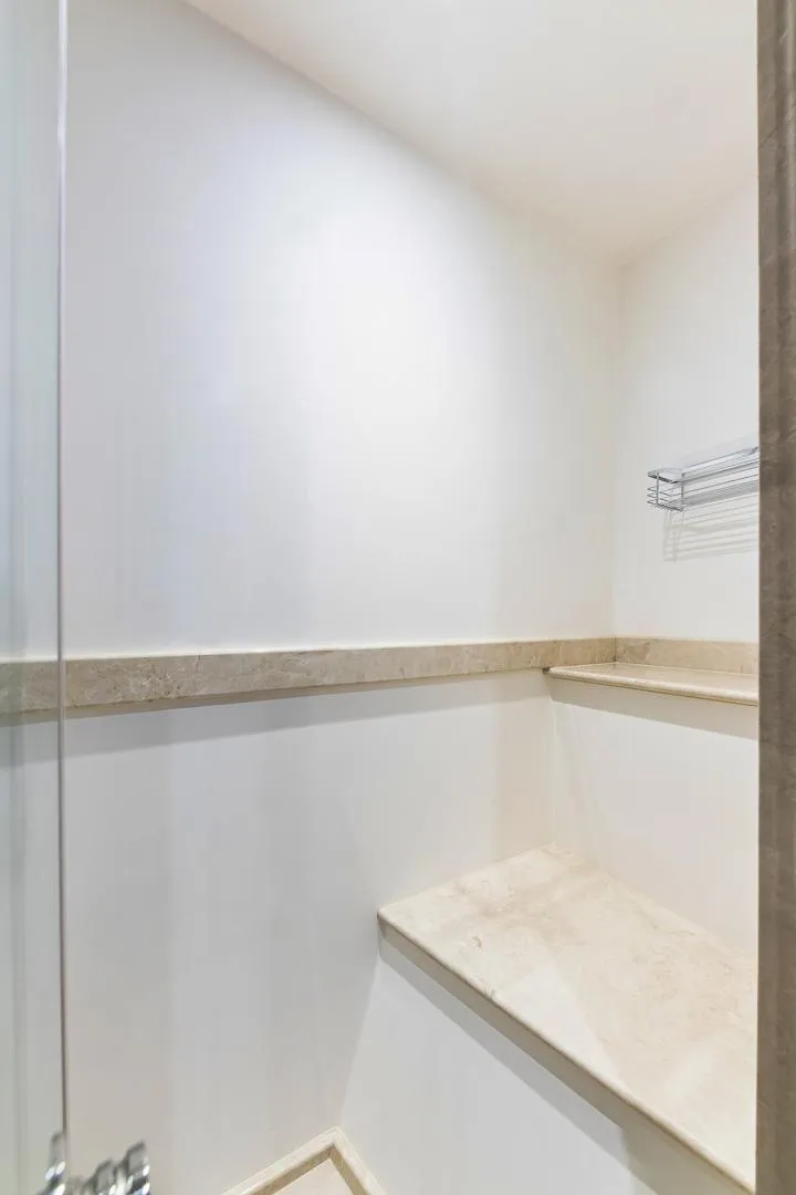 Slide: The Image of 2015 Ocean Alexander Motoryacht Open Bridge shower with marble bench and shelf. - 44