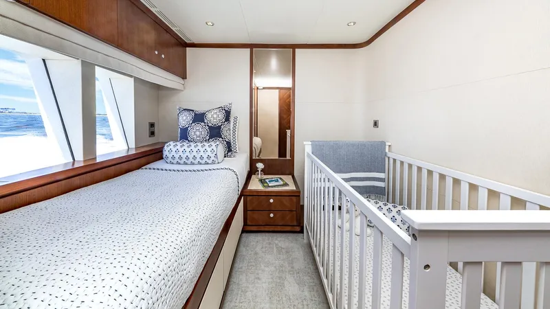 Slide: The Image of 2015 Ocean Alexander Motoryacht Open Bridge bedroom with single bed and crib. - 46