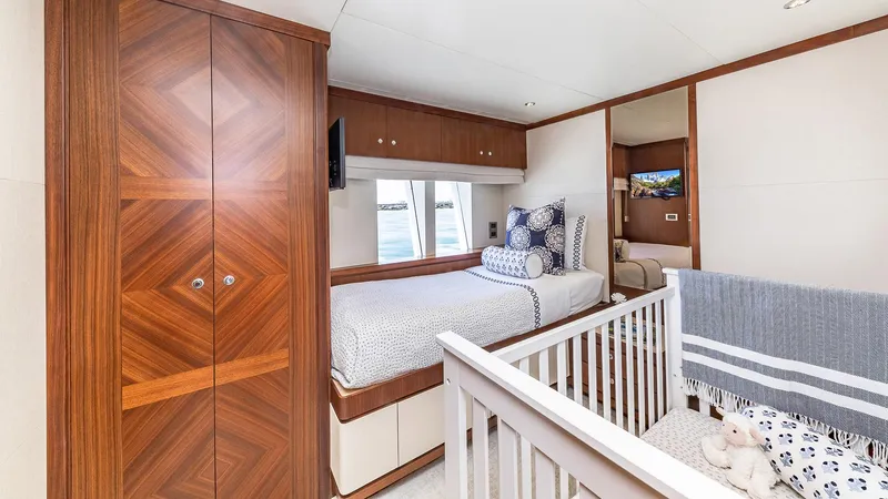 Slide: The Image of Luxurious bedroom with crib on 2015 Ocean Alexander Motoryacht Open Bridge. - 47