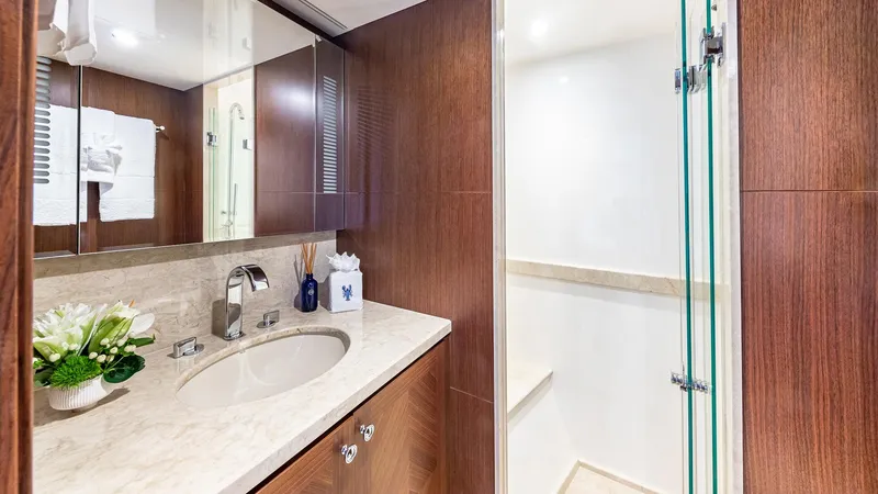 Slide: The Image of Luxurious bathroom in 2015 Ocean Alexander Motoryacht Open Bridge with marble countertop and glass shower. - 48