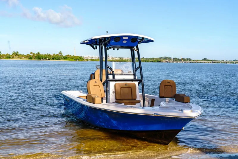 Slide: The Image of 2023 Sea Pro 228 Center Console boat on calm water. - 1