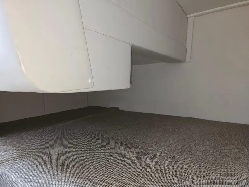 Slide: The Image of Interior cabin of 2015 Sea Ray 260 Sundancer boat with cushioned bed. - 8