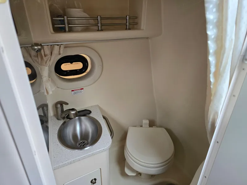 Slide: The Image of 2015 Sea Ray 260 Sundancer boat bathroom with sink and toilet. - 9