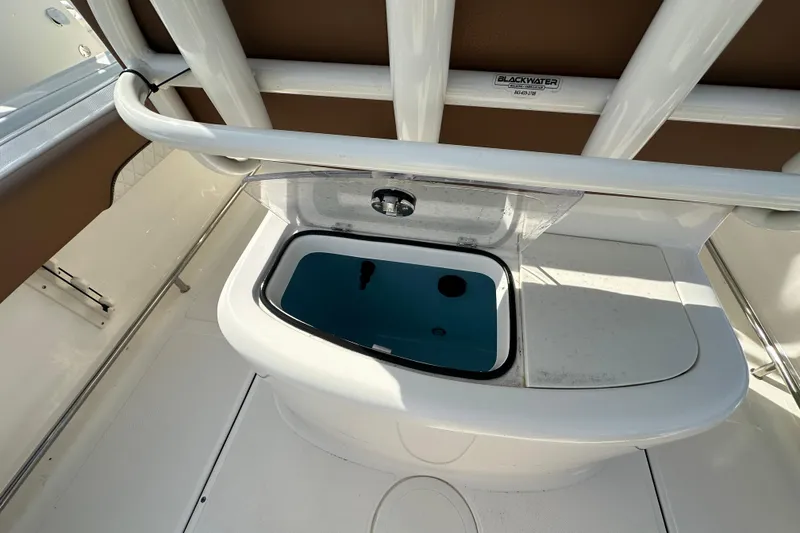 Slide: The Image of 2024 Pioneer 222 Sport Fish boat interior with open storage compartment. - 10