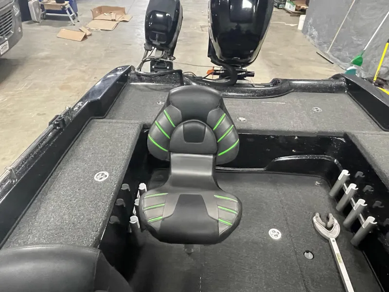 Slide: The Image of 2020 Nitro ZV21 boat interior with black and green seat, dual outboard motors. - 10