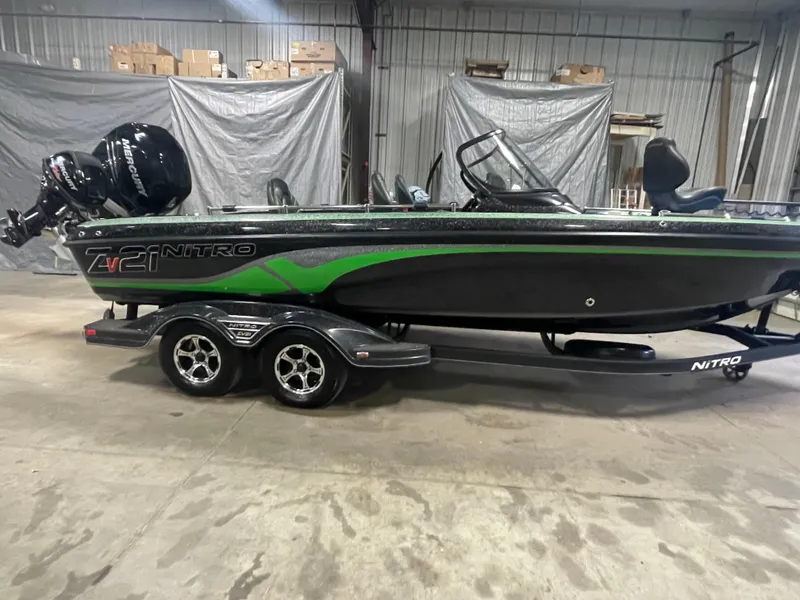 Slide: The Image of 2020 Nitro ZV21 fishing boat with trailer in a warehouse. - 3