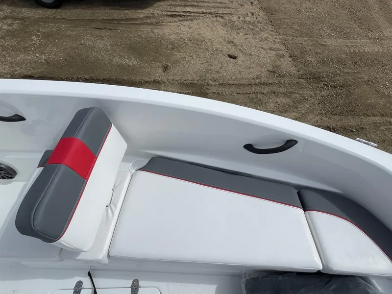 Slide: The Image of 2024 Tahoe T16 boat interior with white, gray, and red cushioned seating. - 14