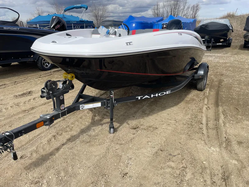 Slide: The Image of 2024 Tahoe T16 boat on trailer in outdoor lot. - 2