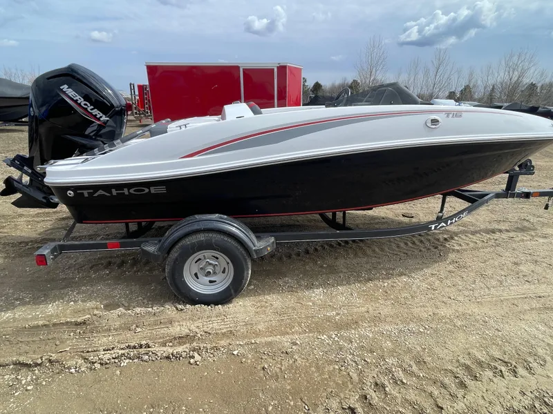 Slide: The Image of 2024 Tahoe T16 boat on trailer, side view, outdoors. - 6