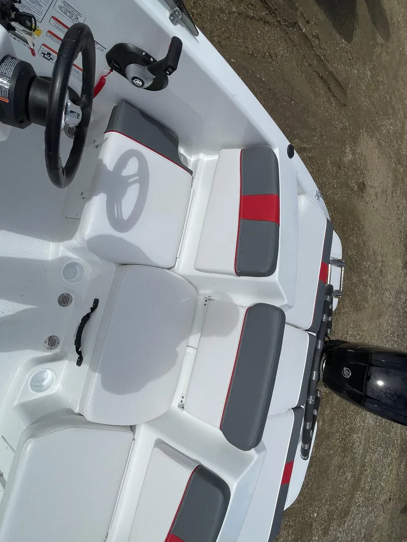 Slide: The Image of 2024 Tahoe T16 boat interior with white and gray seating. - 8