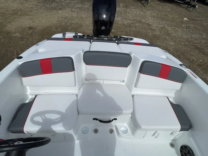 Slide: The Image of 2024 Tahoe T16 boat interior with gray and red seating. - 9