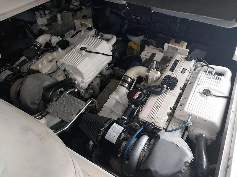 Slide: The Image of Open refrigerator on 2006 Sea Ray 44 Sundancer yacht, showcasing interior shelves. - 11